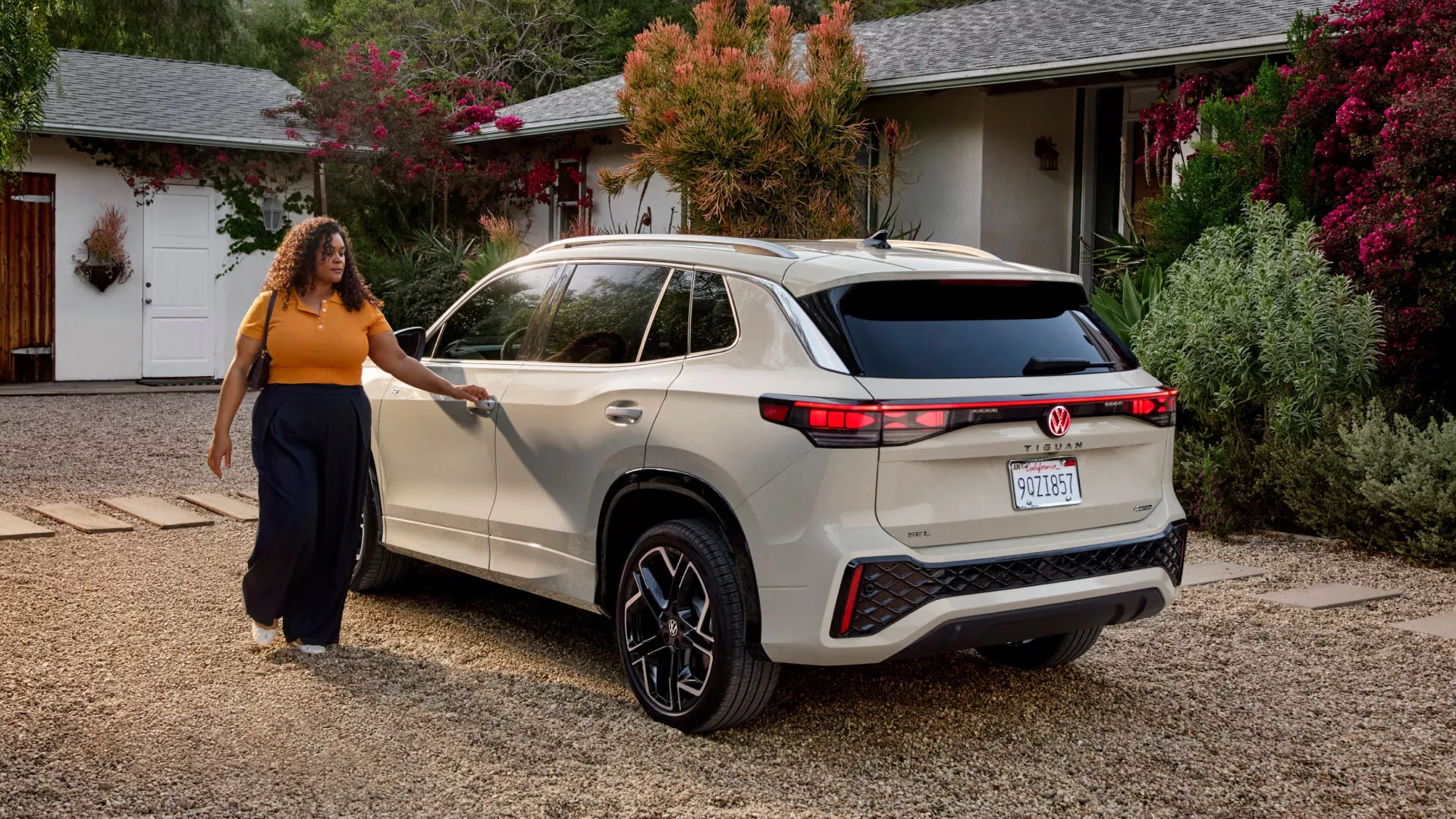 Volkswagen Tiguan owner in residential driveway - serving Greater Los Angeles lease customers
